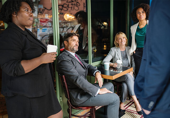People in Coffee Shop Meeting
